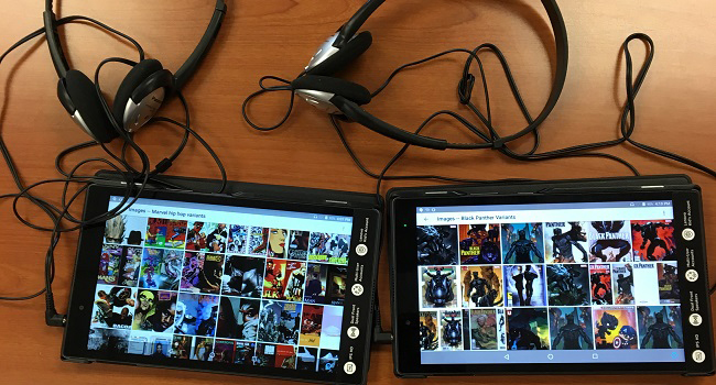 Photograph of tablets with headphones